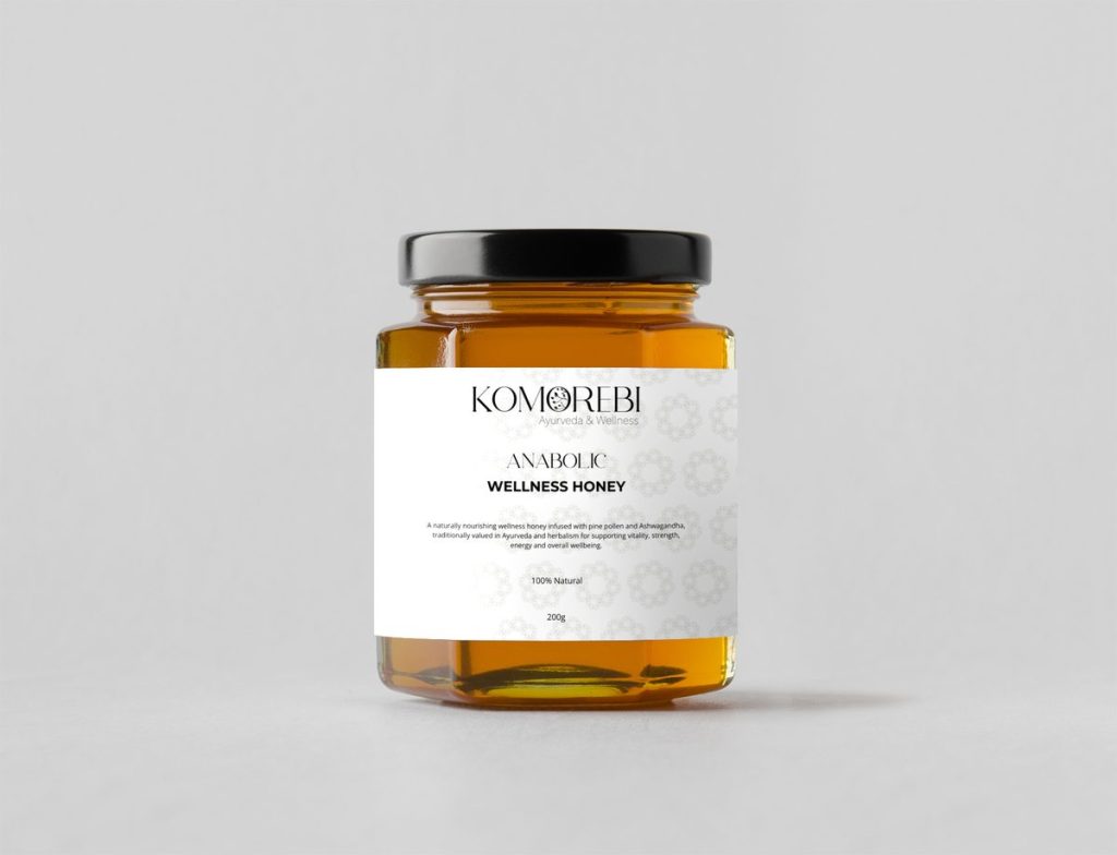 Komorebi Anabolic Wellness Honey 200g in a glass jar with a black lid, golden honey visible through the glass